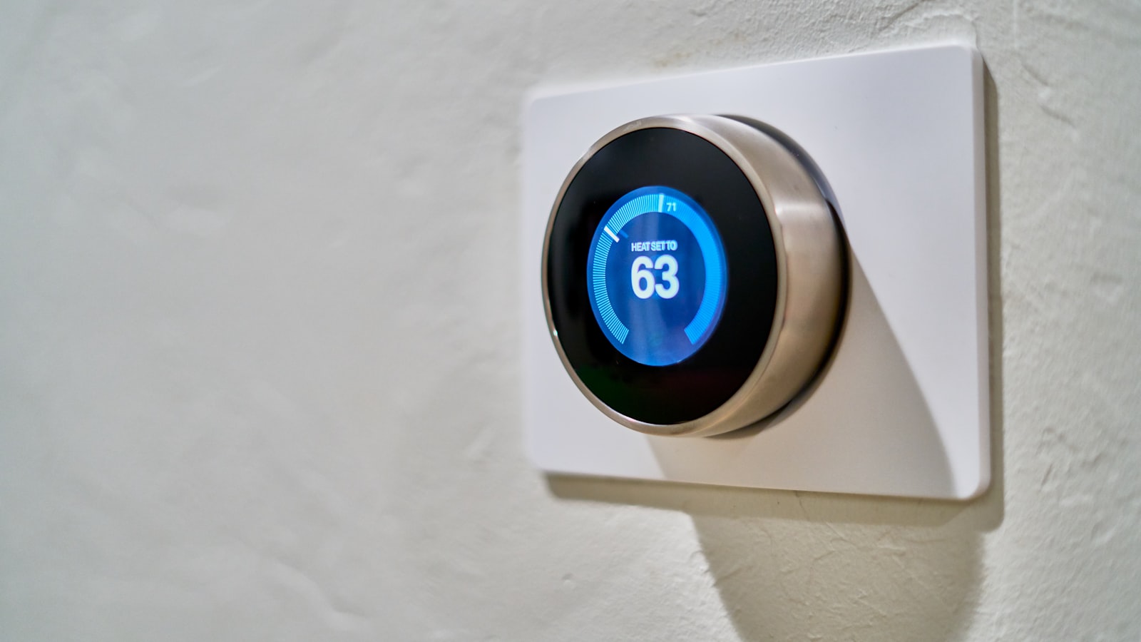 Smart thermostat on a wall